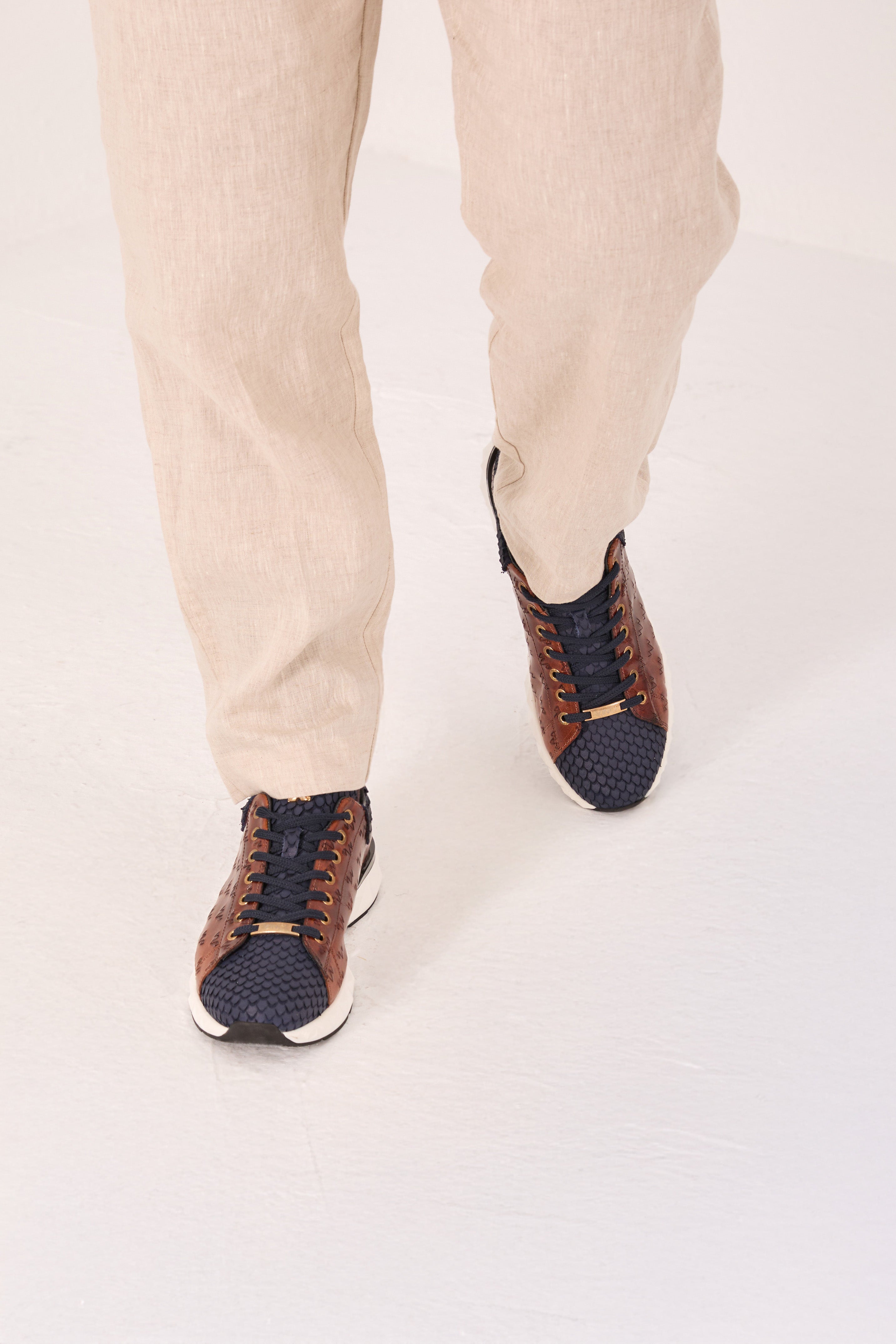 The Caesars Navy Tan Leather Sneaker