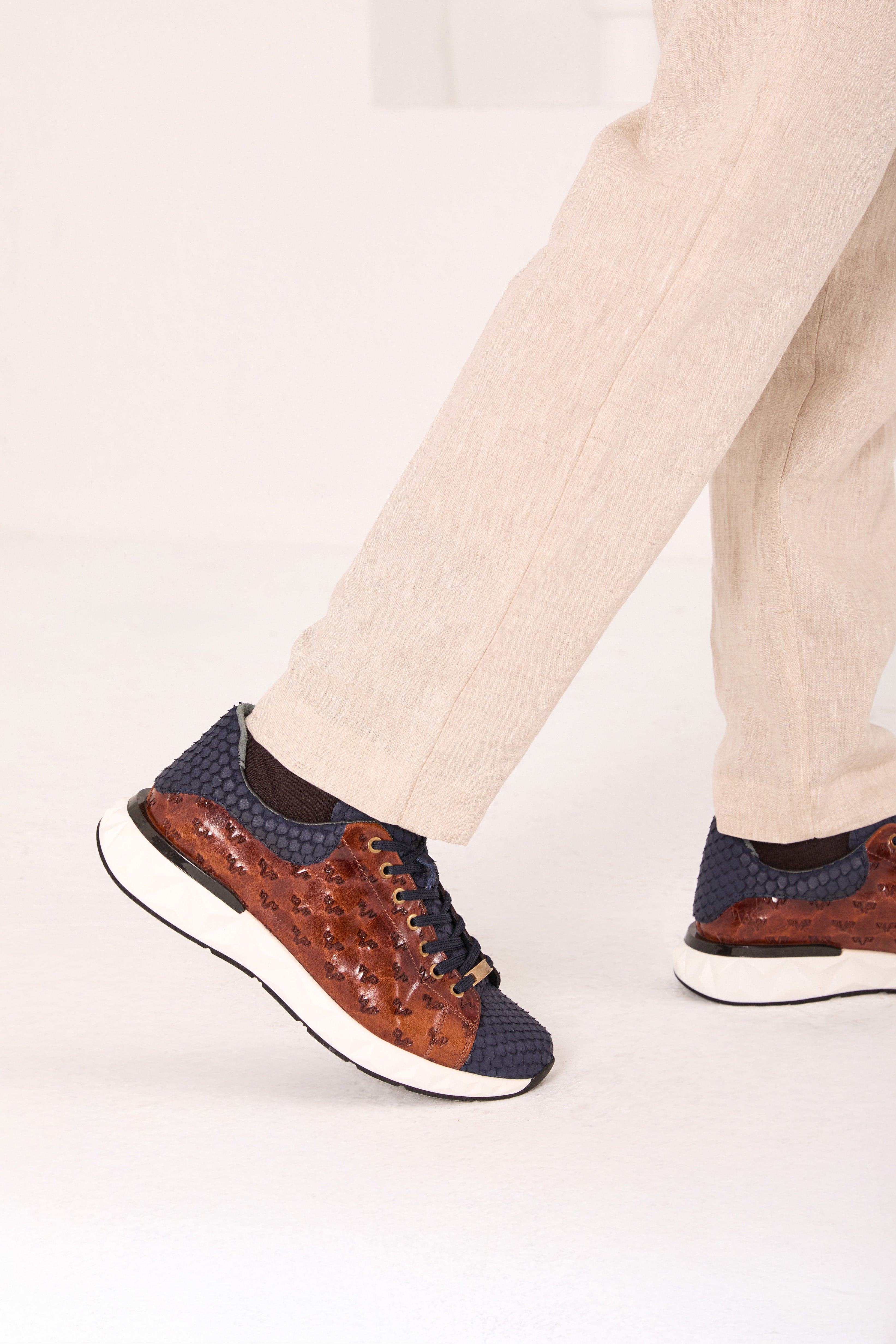 The Caesars Navy Tan Leather Sneaker